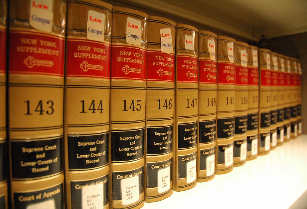 A row of law books ranging from volumes 143 to 157.