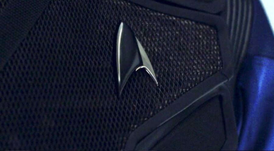 A Starfleet delta badge with black indicating Section 31.