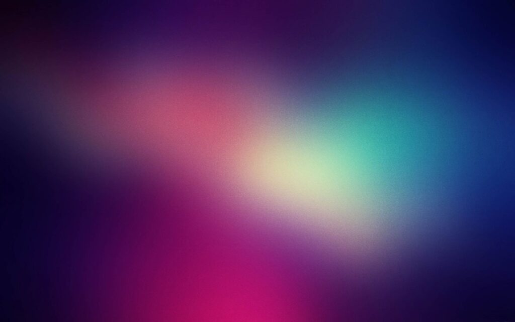 An image of blurred colors, red, white, cyan, purple, and pink, all blended together in an abstract fashion. If I had to guess, it looks like a flamingo with a blue light on its nose, but only if you're seeing it while very drunk.