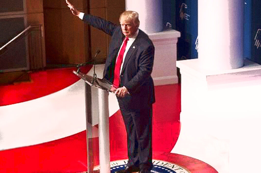 Noted dipshit and garbage fascist Donald Trump raising his hand similar to a Nazi salute. Whether or not he's doing it as a Nazi salute is secondary to him being a dipshit and garbage fascist. Fuck that asshole. 