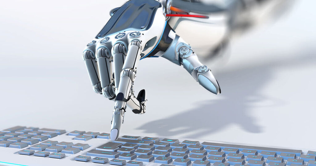 The image of a robotic hand pressing the enter key on a metallic keyboard.