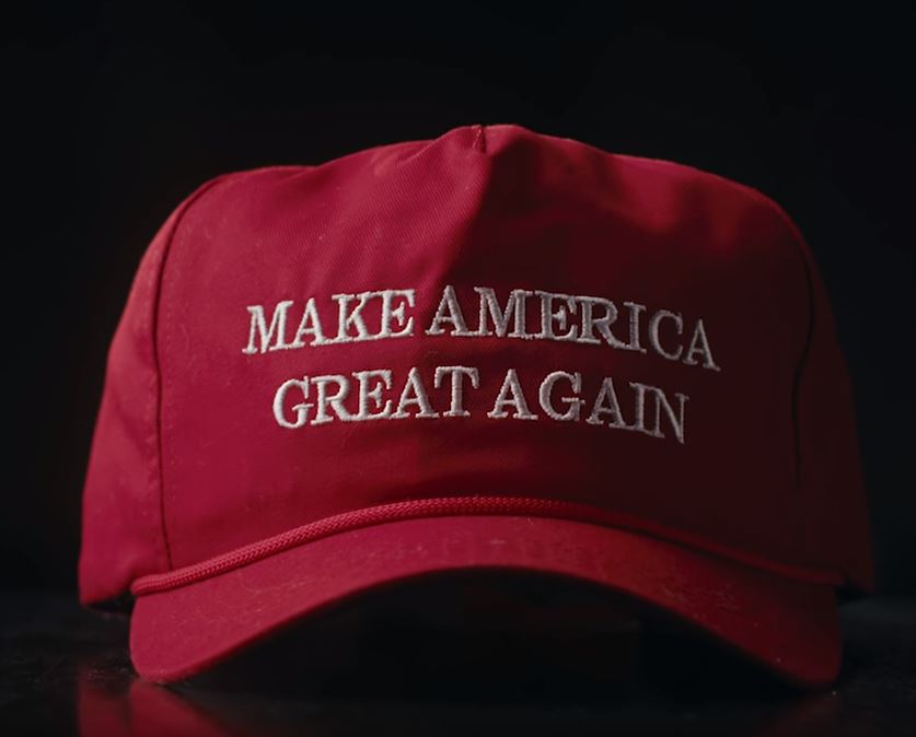 An image of a red baseball cap that reads "make america great again" in white lettering. It is a symbol of hate.